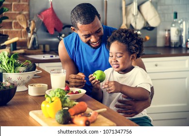 Dad And Son Cooking Together