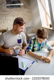 Dad And Son Doing Homework