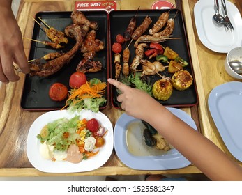 Dad And Son Enjoy Eating Delicious Grilled Meat Belgium Style At The New Restaurant Around Old Town Area, Chiangmai - Thailand, 8 October 2019