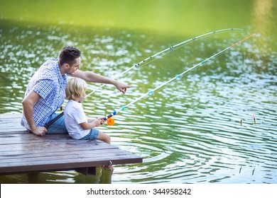 Dad And Son Fishing Outdoors