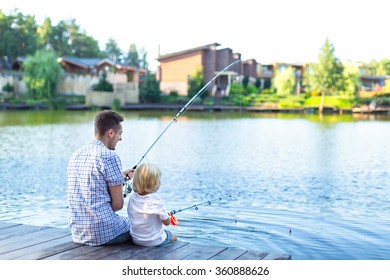 Dad And Son Fishing Outdoors