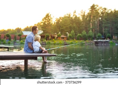 Dad And Son Fishing Outdoors