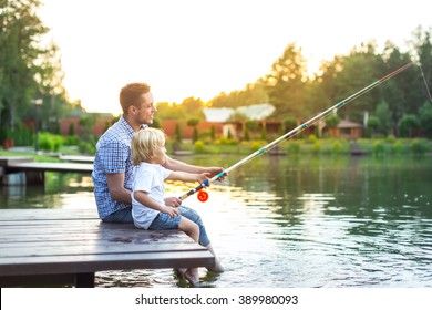 Dad And Son Fishing Outdoors