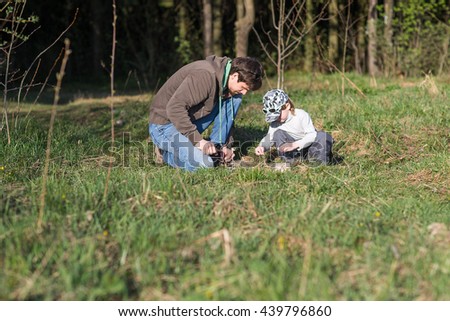 Similar – Image, Stock Photo Little girl putting apple inside of wicker basket