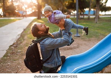 Dad and son swing on a swing. Happy family. The father spends time with the children. High quality photo - Powered by Shutterstock