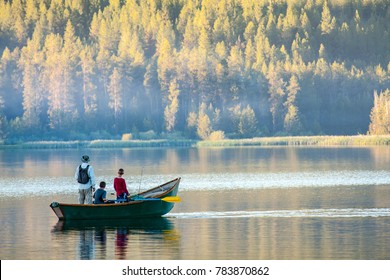 Dad and sons fishing on an Idaho lake - Powered by Shutterstock