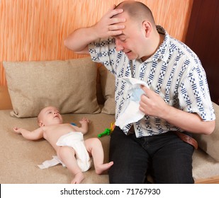 Dad Is Wondering What To Do With Little Baby