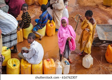 DADAAB, SOMALIA - AUGUST 07: Refugee Camp, Hundreds Of Thousands Of Difficult Conditions, Somali Immigrants Are Staying. African People Waiting To Get In The Water. August 07, 2011 In Dadaab, Somalia.