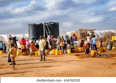 DADAAB, SOMALIA - AUGUST 07: Refugee Camp, Hundreds Of Thousands Of Difficult Conditions, Somali Immigrants Are Staying. African People Waiting To Get In The Water. August 07, 2011 In Dadaab, Somalia.