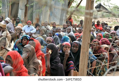 DADAAB, SOMALIA - AUGUST 7: Unidentified women and men live in the Dadaab refugee camp hundreds of thousands of Somalis wait for help because of hunger on August 7, 2011 in Dadaab, Somalia.