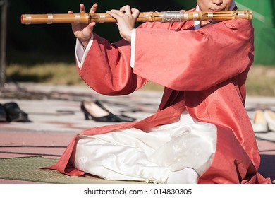 Daegeum - Man playing Korean traditional music instrument