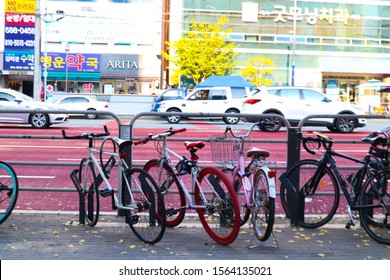 Daegu, South Korea - Novemberl 5, 2019 : Folding Bicycle Parking Beside Road With Public Transport Bus In Background In Daegu, South Korea.