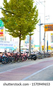 Daegu, South Korea - Novemberl 5, 2019 : Folding Bicycle Parking Beside Road With Public Transport Bus In Background In Daegu, South Korea.