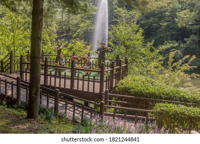 Daejeon, South Korea; August 24, 2020: For Editorial Use Only. Sculptures Of Family Playing Musical Instruments In Park With Water From Fountain In Background. (Artist Unknown.)