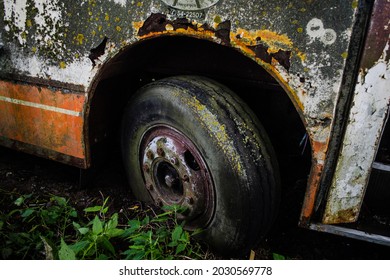 Dagda, Latvia - July 1, 2020: Rusty, Old Abandoned Bus Wheel.