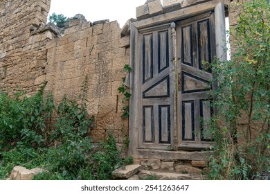 Dagestan Gamsutl. Ancient ghost town of Gamsutl old stone houses in abandoned Gamsutl mountain village in Dagestan, Abandoned etnic aul, summer landscape. - Powered by Shutterstock