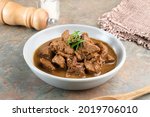 
Daging Kelem is a traditional food from Central Java, Indonesia, made from beef, coconut milk and spices. It tastes sweet and savory. Served in bowl, close up.