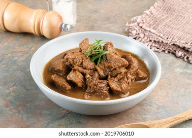
Daging Kelem is a traditional food from Central Java, Indonesia, made from beef, coconut milk and spices. It tastes sweet and savory. Served in bowl, close up. - Shutterstock ID 2019706010