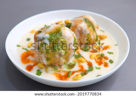 Dahi Bhalla or Dahi Vada is a type of chaat dish from India. It is prepared by soaking urad dal vadas in creamy yogurt with green and red chutney. Tri color dish. Indian Tiranga Flag colors food.