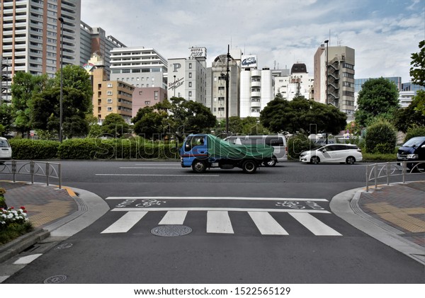 Daiichikeihin Ave,Omorihoncho,Ota\
City/Tokyo -  August 31th,2019 : View of urban street with\
residential buildings\
background,Tokyo,Japan.