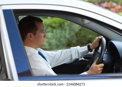 The Daily Commute. Profile Of A Businessman Driving His Car To Work.