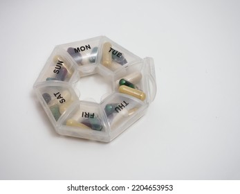 Daily Dose Of Capsule Tablets In A Container