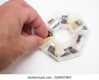 Daily Dose Of Capsule Tablets In A Container