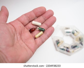 Daily Dose Of Capsule Tablets In A Container