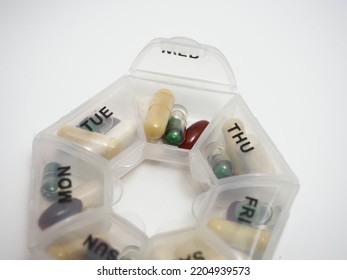 Daily Dose Of Capsule Tablets In A Container