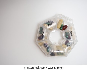 Daily Dose Of Capsule Tablets In A Container