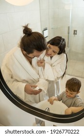 Daily Hygiene. High Angle View Of The Nice Happy Family Preparing To Brushing Their Teeth While Doing Morning Hygienic Procedures. Stock Photo