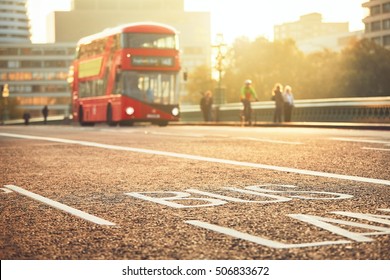 Daily life in the city. Bus lane and bus of the public transport on the street. London, The United Kingdom of Great Britain and Northern Ireland