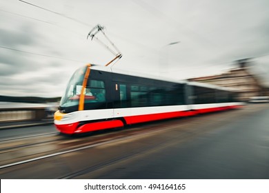 Daily life in the city. Tram of the public transport on the street - blurred motion