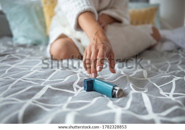 Daily Life of a Person with
Asthma. Woman is living life with chronic illness everyday and
overcoming challenges with it. Her inhaler makes all the
difference