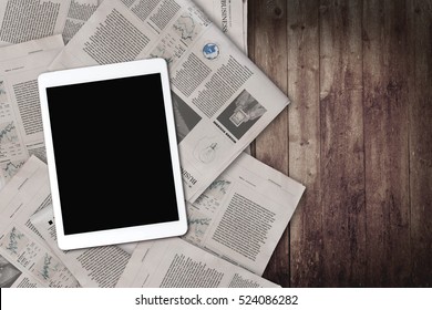 Daily News And Tablet On The Old Wooden Table. Top View.