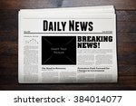 Daily Newspaper with wooden background.