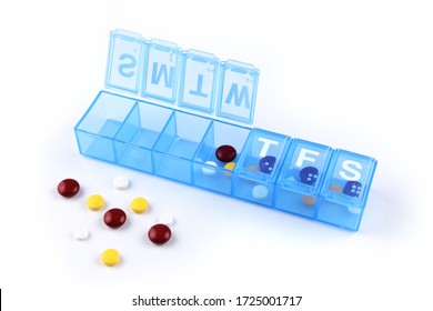 Daily Pill Box With Medical Pills On White Background.