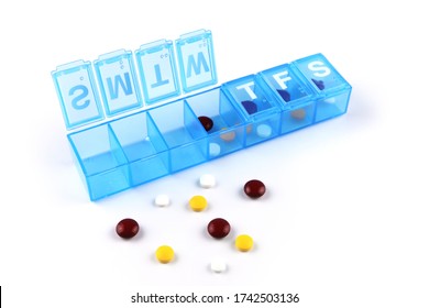 Daily Pill Box With Medical Pills On White Background.