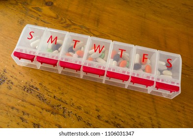 Daily Pill Organizer Filled With Pills