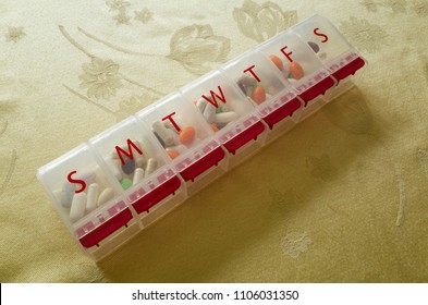 Daily Pill Organizer Filled With Pills