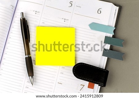 Daily planner with some sticky notes, copy space , business concept