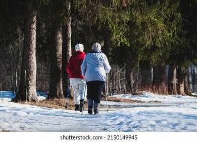 Daily Pole Walk In The City Park, Senior Women Exercise In Early Spring Outdoors