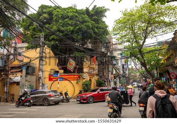 daily traffic in Hanoi, Vietnam,\
5.3.2019. Hanoi is a beautiful city with friendly people, cars,\
overloaded motocycles, little shops, delicious\
meals.