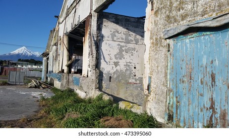 Dairy Factory Ruins In New Zealand With Mount Taranaki In Background