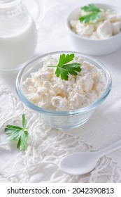 Dairy product - curd or cottage cheese, quark in bowl and milk on white background