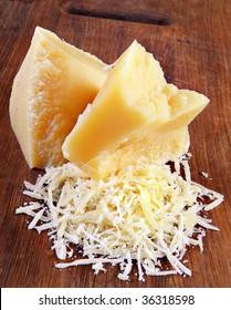 Dairy Product Parmesan Cheese Grated On Board