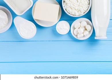 Dairy Products On Blue Wooden Background, Top View