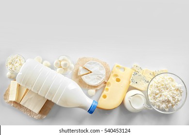 Dairy products on white background, top view