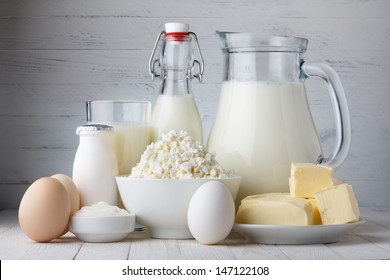 Dairy products on wooden table - Shutterstock ID 147122108