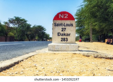 Dakar Road Sign Against Clear Blue Sky.